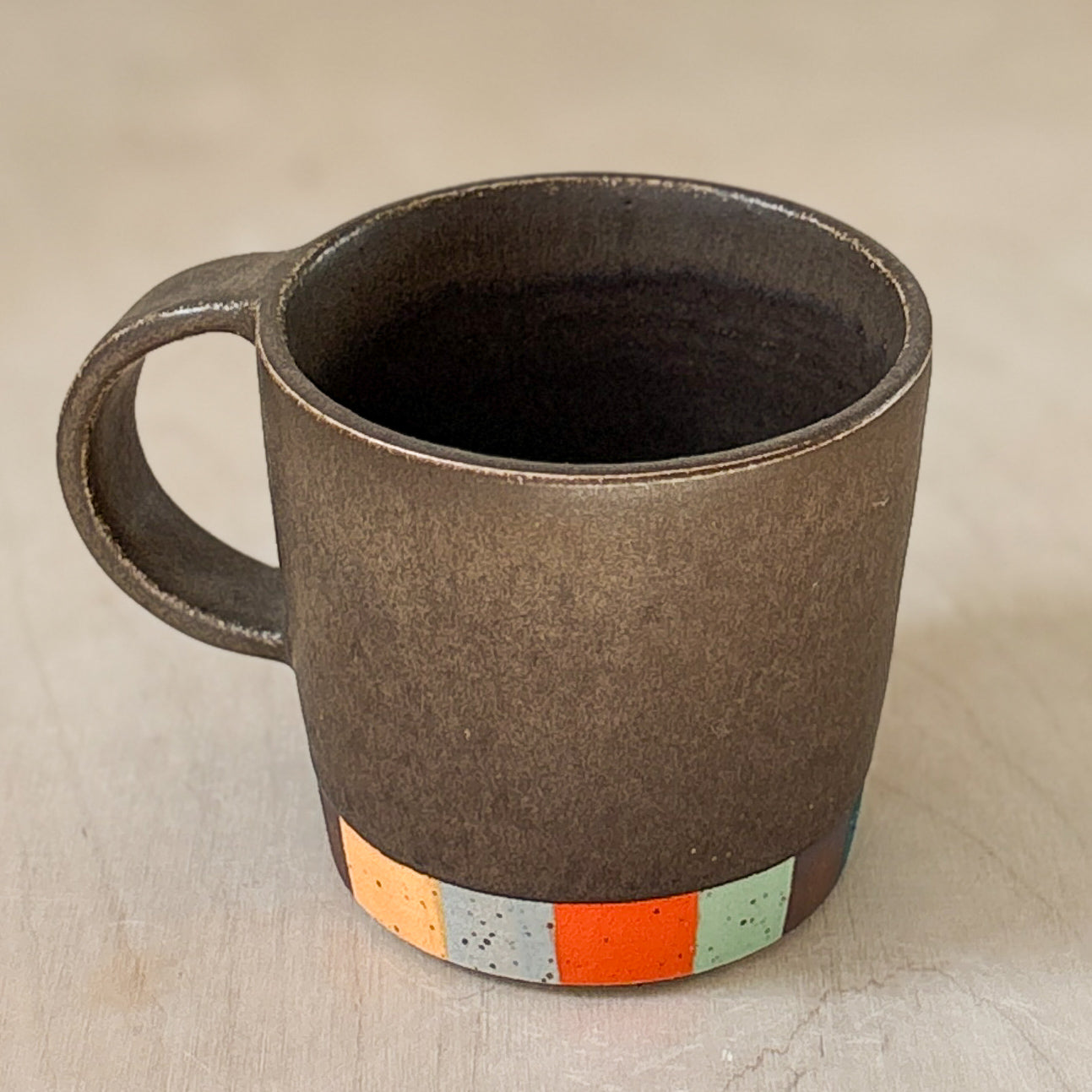 Tapered coffee cup in brown