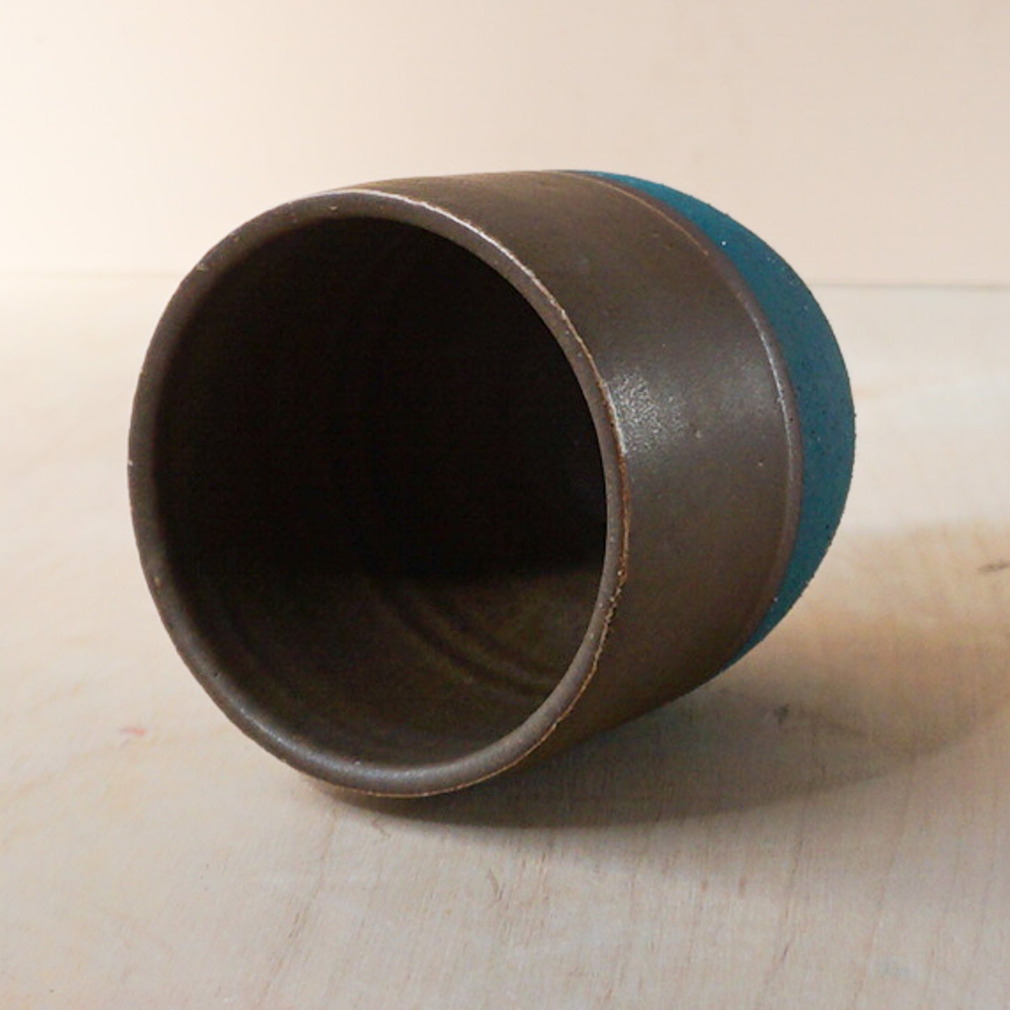 Tumbler in teal and brown