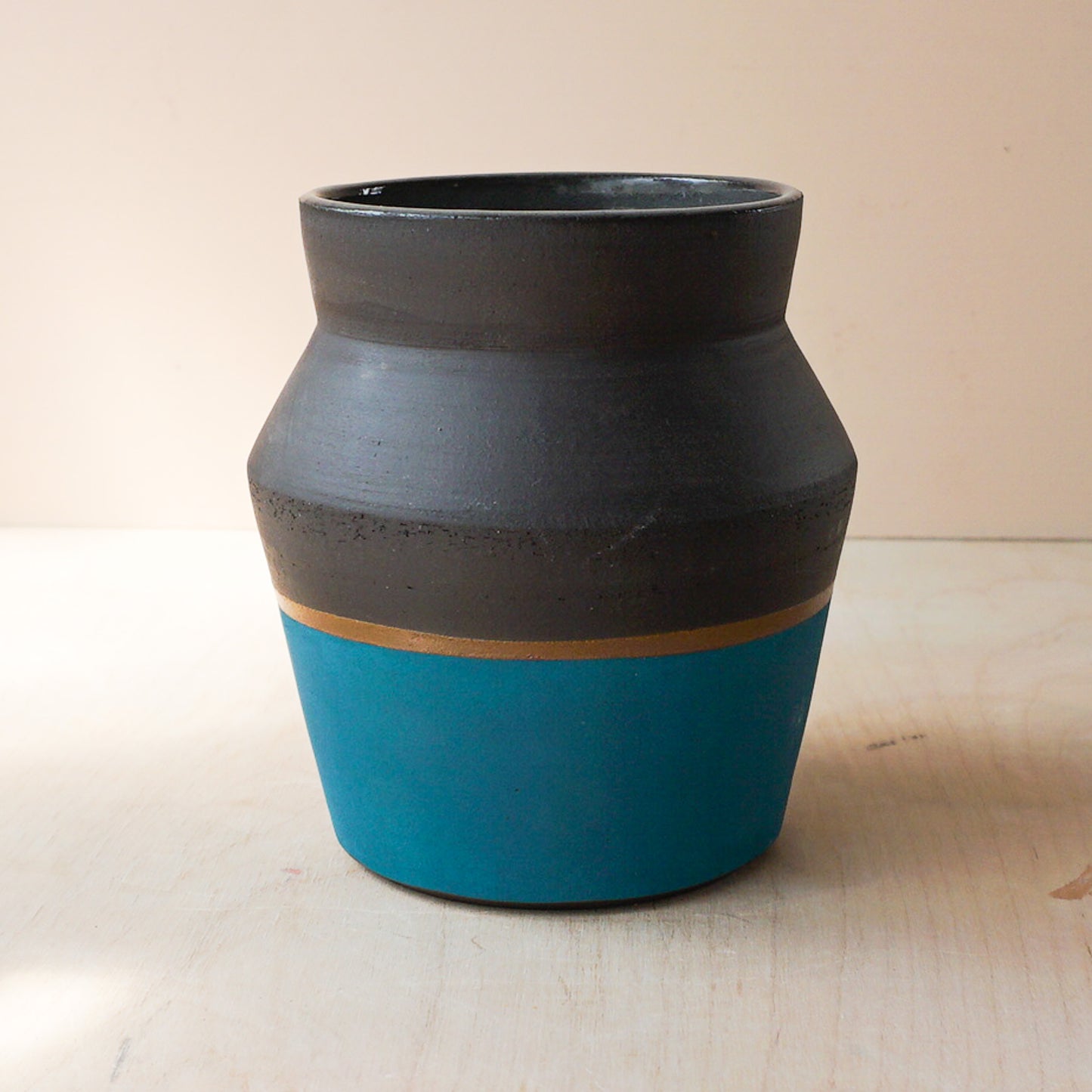 Angled vase in black, teal and gold