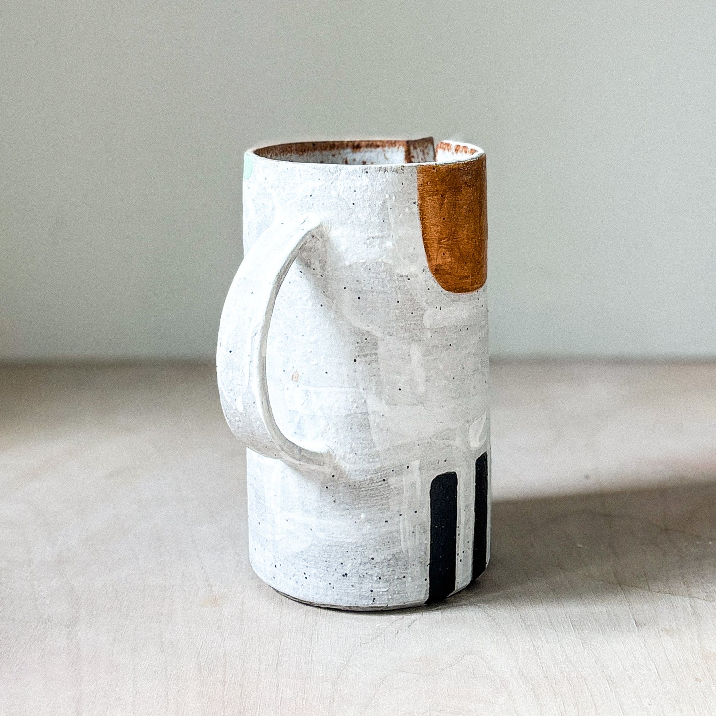 Stoneware jug with white slip
