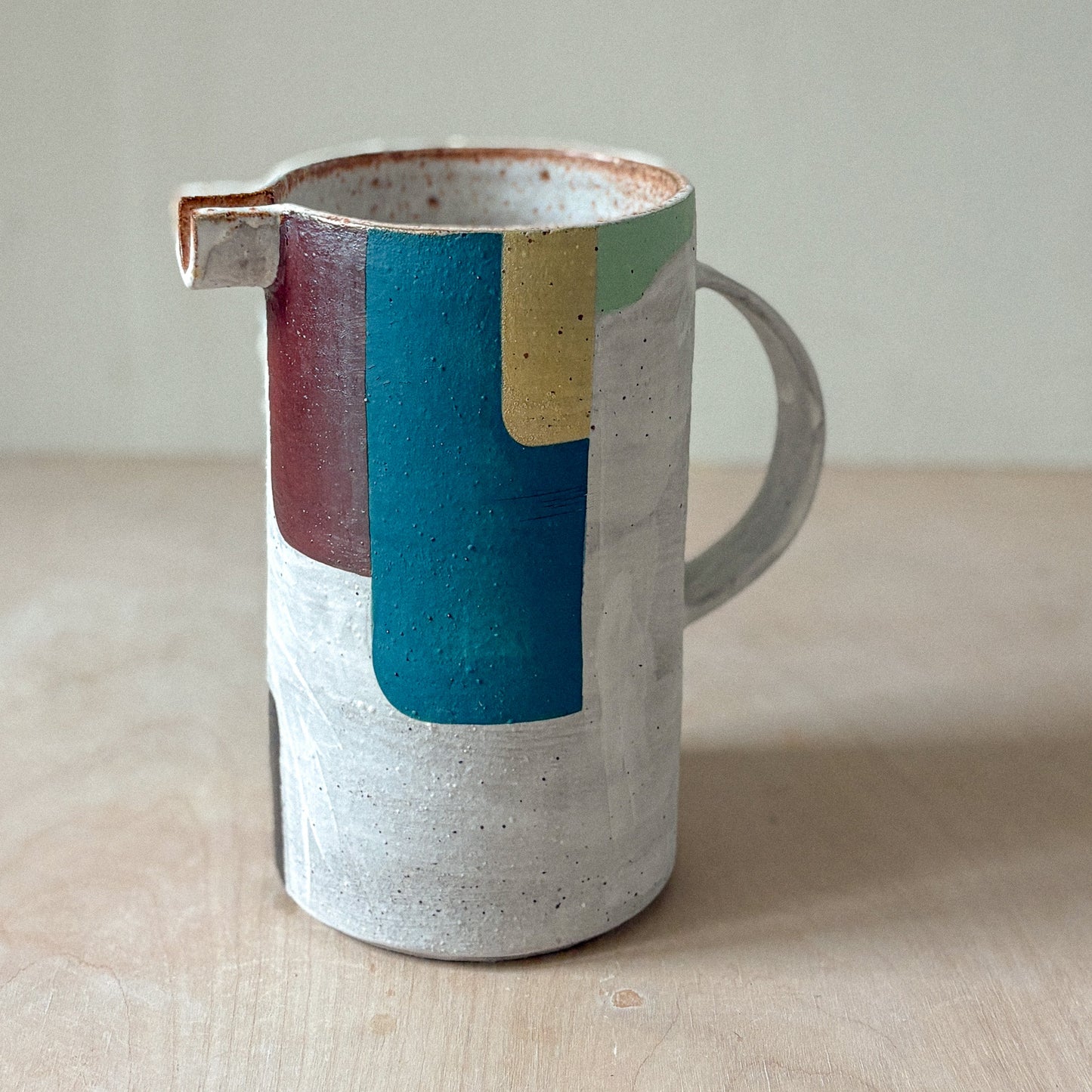 Stoneware jug with white slip